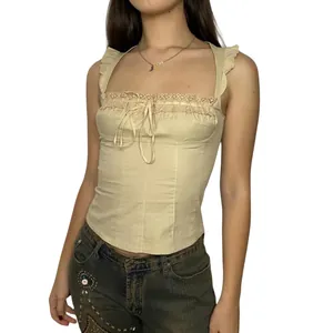 Elegante canotta in cotone beige senza maniche con pizzo delicato e dettaglio fiocco