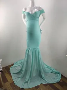 Detailed view of the mint green off-shoulder maternity dress with chiffon mermaid tail