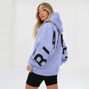 Back view of oversized lavender hoodie with bold black BLAKE lettering detail