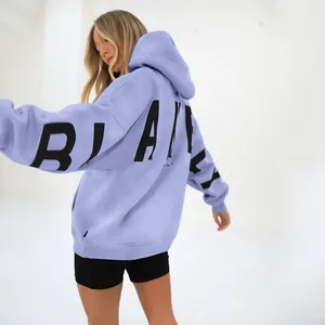 Back view of a lavender oversized heavyweight hoodie with bold black BLAKE letter printing