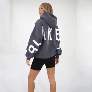 Back view detail of oversized gray hoodie featuring white BLAKE ORIGINAL LIFE print