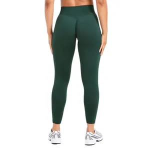 High-waisted seamless dark green yoga leggings with peach butt lifting design back view