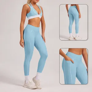 Hellblaue Damen Yoga-Leggings mit hoher Taille, Kontrastpaspeln und praktischen Seitentaschen.