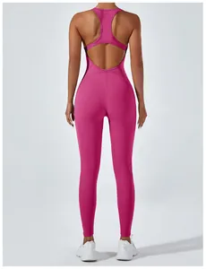 Back view of a hot pink backless one-piece yoga jumpsuit with a racerback design.