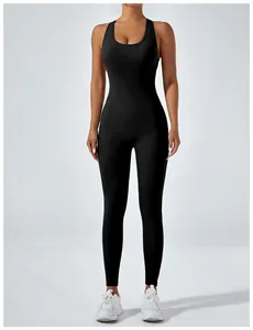 Professional front view of a black high elastic one-piece yoga bodysuit on an athletic model