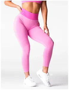 Women's high-waisted pink seamless yoga leggings with elastic waistband for gym fitness