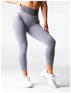 Detail view showing the fit and texture of seamless high-waisted grey yoga leggings.