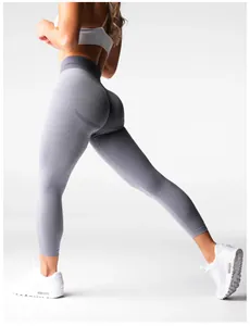 Detailed side view showing the texture and fit of grey seamless scrunch butt yoga pants