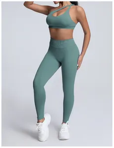 Detail view of teal seamless high-waisted yoga leggings with peach lift effect
