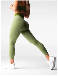 Macro detail of green high-waisted seamless yoga leggings with scrunch butt design.