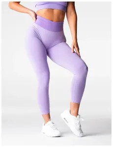 Seamless purple high waist yoga leggings with butt lifting design on fit model