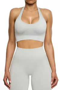 Close-up of seamless light grey yoga set with halter neck bra and high waist leggings