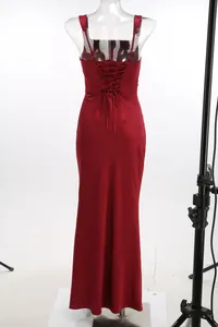 Detailed back view of wine red evening gown with elegant lace-up corset design detail