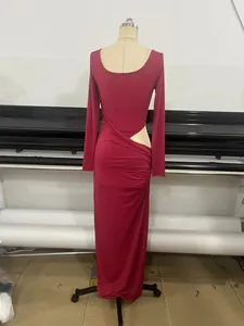 Elegant red long sleeve maxi dress with sexy side cutout and ruched detailing on mannequin
