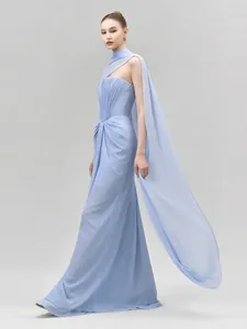 Detailed view of an elegant light blue off-shoulder evening gown with shoulder sash.