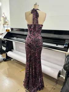 Detailed back view of a sexy leopard print halter maxi dress with ruched design