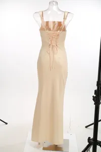 Detailed view of the elegant champagne evening dress with a corset lace-up back