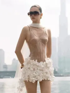 Detail view of the elegant sequin dress with intricate white 3D flower decorations.