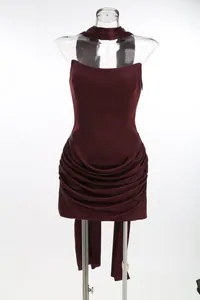 Elegant burgundy strapless bodycon dress featuring a sophisticated ruffled draped mini skirt
