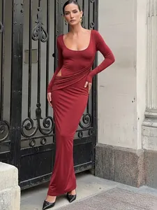 Elegant full-length view of a red bodycon dress featuring side cutout and ruched waist