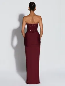 Back view of elegant burgundy strapless evening gown with sequined bodice and pleats