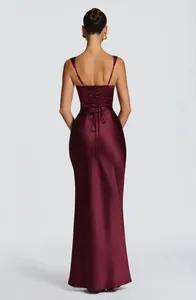 Close-up back view of elegant burgundy satin maxi dress with adjustable lace-up detail