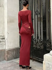 Close-up back detail of elegant burgundy long-sleeved maxi dress with sexy cutout and ruching