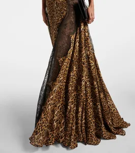 Close-up of a leopard print maxi dress featuring exquisite black lace patchwork detail