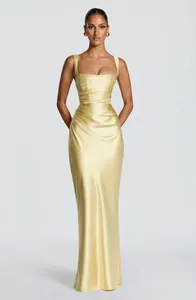 Detail of the elegant yellow satin pleated sleeveless maxi evening dress with a slim fit