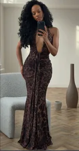 Elegant leopard print maxi dress with a deep V-neck halter design and slim fit silhouette
