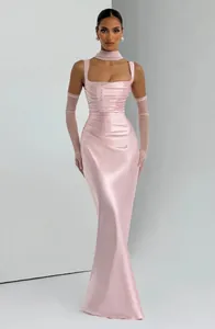 Full view of elegant pink satin pleated long evening dress with matching sheer gloves