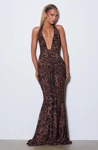 Elegant leopard print halter neck maxi dress featuring a deep V-neck and ruched details