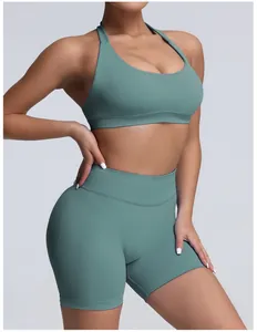 High-waisted seamless matte green yoga shorts and sports bra set for fitness training