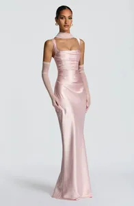Full length display of pink satin pleated gown including sheer gloves and choker