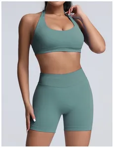 Close-up of seamless matte green yoga set featuring high-waist shorts and bra