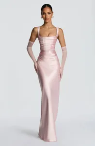 Professional full-length view of a pink satin pleated evening gown with matching tulle gloves.