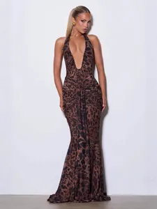 Sexy deep V-neck halter leopard print maxi dress with slim-fit bodycon silhouette.