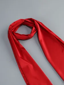 Detailed close-up view of the smooth red satin fabric with a subtle sheen for elegance