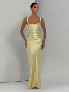 Elegant pale yellow satin evening gown featuring pleated waist and floor-length design