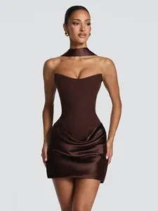 Elegant brown strapless corset mini dress with draped satin skirt and choker accessory.