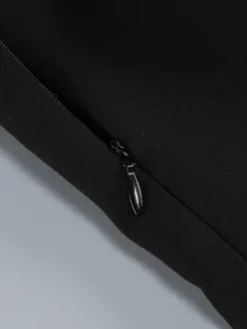 Close-up of high-quality invisible zipper on a black elegant bodycon evening dress