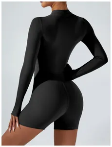 Back view of a black long-sleeved one-piece athletic fitness jumpsuit for women