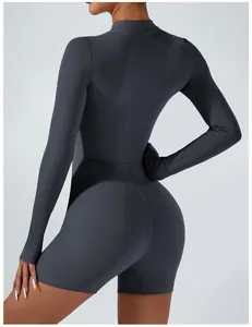 Back view of a high-stretch long sleeve dark grey athletic bodysuit for yoga and fitness