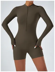 Close-up view of a dark olive green long-sleeve athletic romper with a zip front