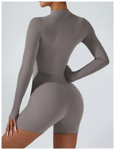 Back view of a long-sleeved tight sports bodysuit showing athletic fit and grey fabric