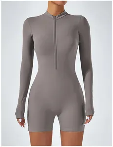 Close-up view of a grey long sleeve bodysuit with front zipper for yoga and fitness