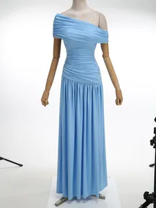 Elegant light blue one-shoulder ruched maxi dress displayed on a mannequin