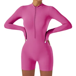 Women's vibrant hot pink long sleeve yoga romper with front zipper closure for fitness