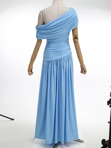 Detail view of a light blue off-shoulder ruched maxi evening dress on a mannequin