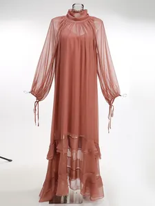 Full-length view of sheer pleated mauve maxi dress with ruffled hem and stand collar